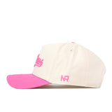 Introducing the Michigan State Pink Out Hat by No Rivals—a cream-colored baseball cap featuring a pink brim and pink embroidered details, including the NR initials on the side. Officially licensed, this snapback offers both style and comfort for dedicated fans.