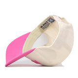The Virginia Tech Pink Out Hat by No Rivals is displayed upside down, revealing its cream and pink interior with No Rivals tags, a QR code label, and a classic snapback closure for adjustable comfort.
