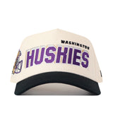 Show your team spirit in the No Rivals Washington Huskies Alma Mater Hat—a white snapback featuring a black brim, bold “WASHINGTON HUSKIES” lettering in purple and black on the front, plus embroidered logos and a football helmet graphic on the side. Perfect for your next gameday fit!.