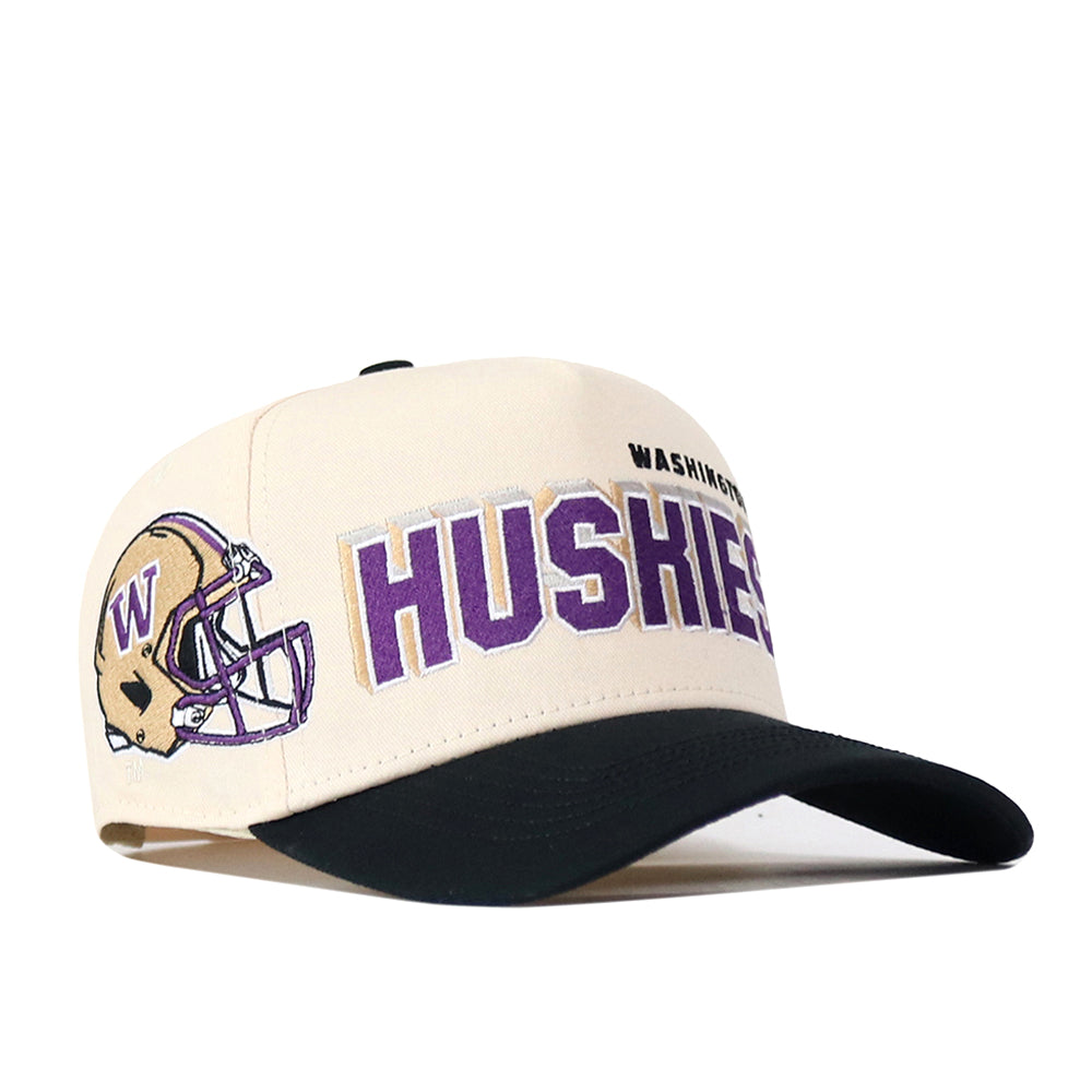 The No Rivals Washington Huskies Alma Mater Hat is a cream and black snapback featuring a football helmet with a purple W and bold purple and gold Huskies text, highlighted by embroidered logos for the perfect gameday fit.