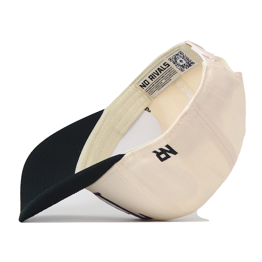 The TCU Aer Lingus Football Hat by No Rivals is displayed flipped inside out, showcasing the interior label that reads “NO RIVALS” alongside a visible QR code. Made from high quality cotton, this cap features a black brim and a stylized embroidered R logo on the side. The snapback adjustment at the back ensures a comfortable fit for everyone.