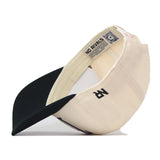 The TCU Aer Lingus Football Hat by No Rivals is displayed flipped inside out, showcasing the interior label that reads “NO RIVALS” alongside a visible QR code. Made from high quality cotton, this cap features a black brim and a stylized embroidered R logo on the side. The snapback adjustment at the back ensures a comfortable fit for everyone.