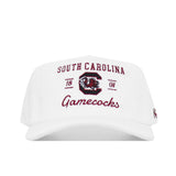 The South Carolina Vintage Cord Hat - White is an unstructured fit baseball cap with embroidered South Carolina and Gamecocks text, the university’s gamecock logo, and 1801 on the front.