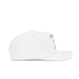 The South Carolina Vintage Cord Hat in white is displayed from the side, featuring an unstructured fit and a minimal design with only a hint of small text on the front.