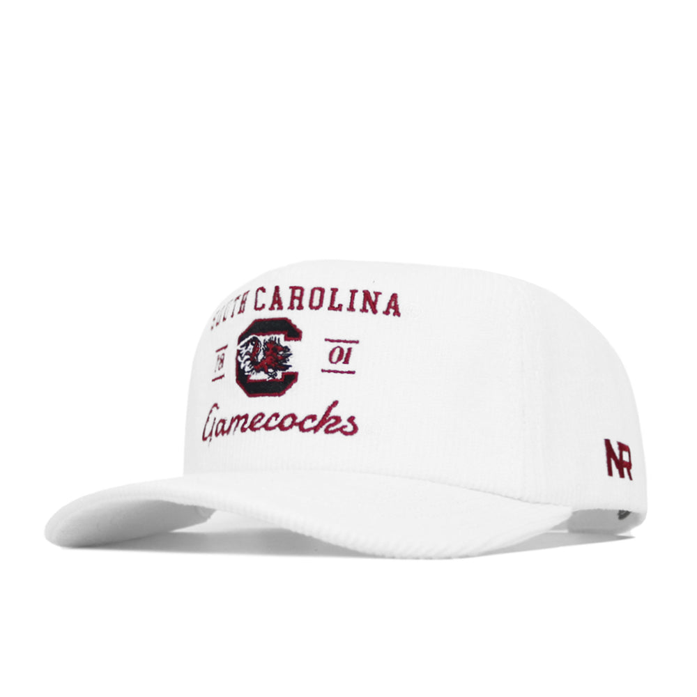 The South Carolina Vintage Cord Hat - White features garnet and black Gamecocks text and logo on the front, an embroidered NR logo on the left side, and an unstructured fit for all-day comfort.