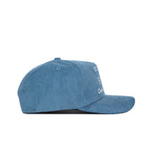 The Ole Miss Vintage Cord Hat by No Rivals is a powder blue, unstructured-fit snapback with a flat brim and partially visible white embroidered text on the front.