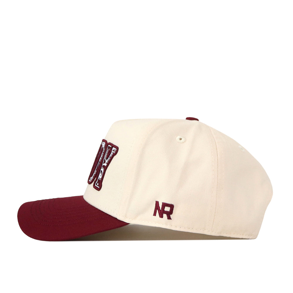 The Texas A&M Paisley Howdy Hat by No Rivals features a cream crown with a maroon brim and bold maroon “NY” lettering on the front. The side is detailed with small maroon NR initials, while the snapback closure ensures a comfortable, adjustable fit.