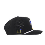 The No Rivals South Dakota State Golf Hat in black is shown in a side profile view, featuring small ventilation holes on the side, a white trim above the brim, and a small yellow and blue flag patch. This cap offers convenient snapback adjustment for a secure, customizable fit.