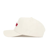 The Indiana Sideline Hat by No Rivals is a plain white snapback, shown from the side, with subtle white NR embroidery and partially visible red text on the front. Made of high-quality cotton for a comfortable, structured fit.