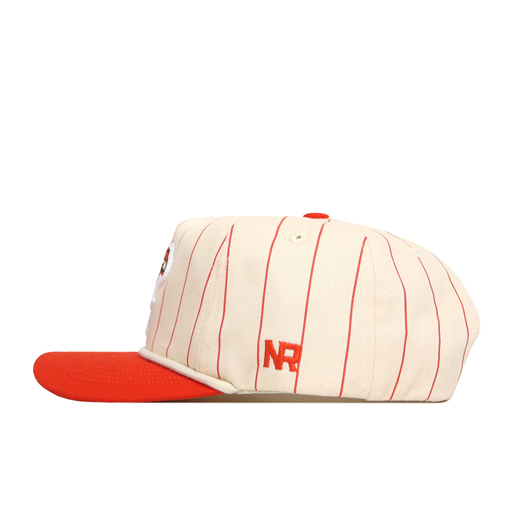 The Bowling Green State Falcons Pinstripe Hat by No Rivals features cream cotton fabric with thin red pinstripes, a bold red flat brim, and “NR” embroidered in red on the side. Designed for comfort and style, it includes a durable snap back closure for an adjustable fit.