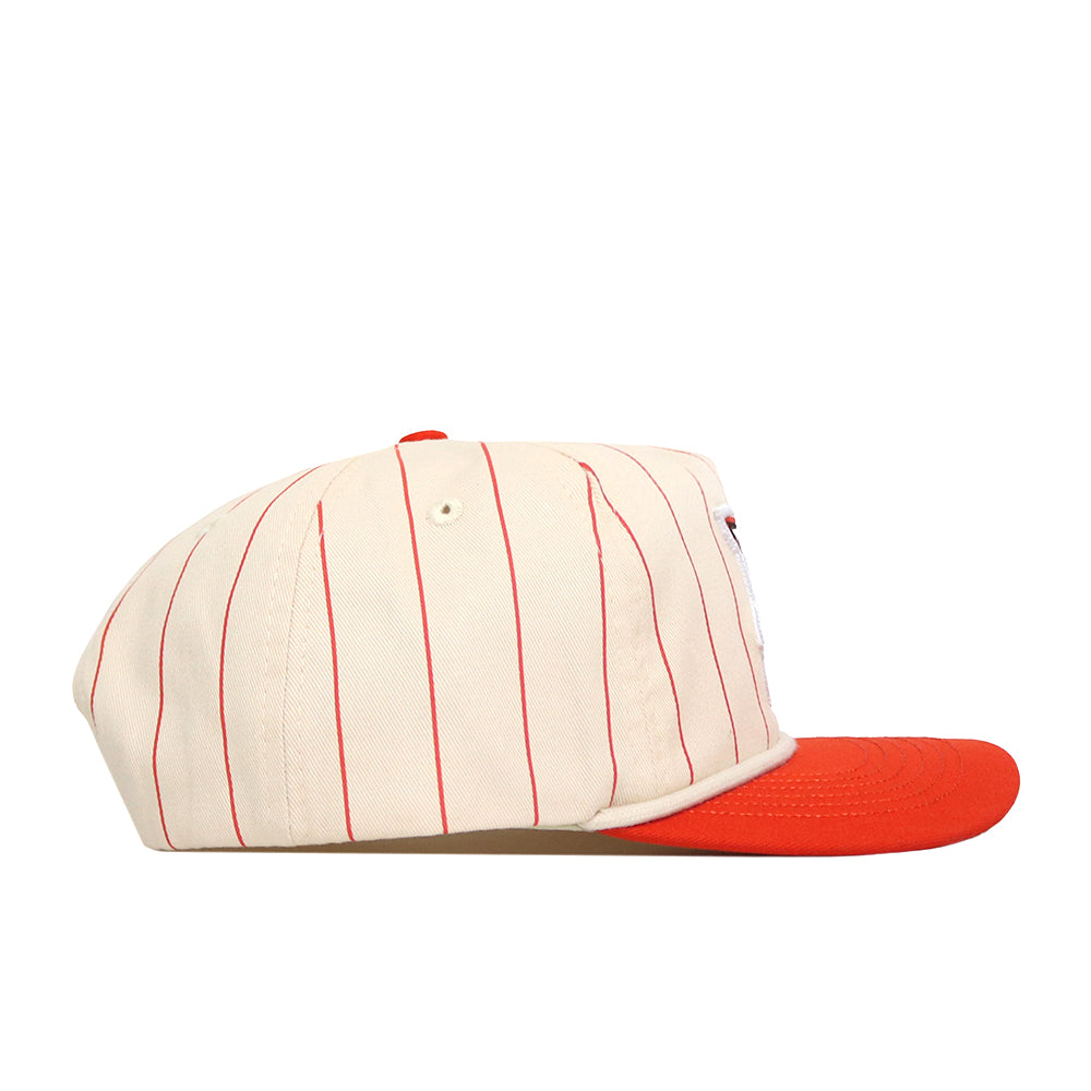 No Rivals Bowling Green State Falcons Pinstripe Hat, shown from the side against a white background, features a cream-colored cotton construction with thin red vertical stripes, a solid red brim, and a snapback adjustment for a comfortable fit.