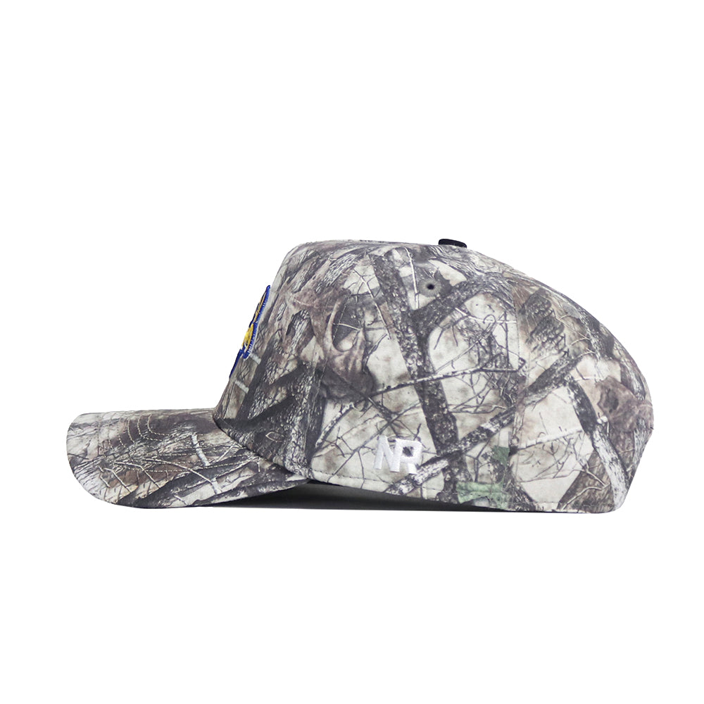 Side view of the No Rivals South Dakota State Outland Hat, a structured fit snapback with a flat brim, camouflage pattern in brown, gray, and green, and a stitched white NR logo on the side.