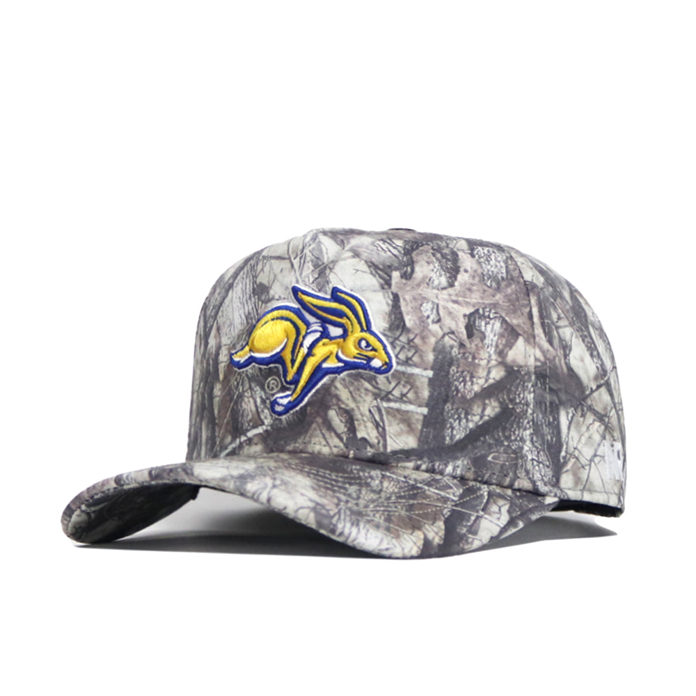 The South Dakota State Outland Hat by No Rivals is a structured camo baseball cap with an embroidered yellow and blue jackrabbit logo, made from premium cotton and features a snapback closure.