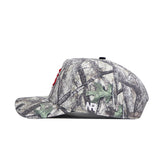 Side view of the Fresno State Outland Hat by No Rivals, a structured camo snapback with tree and leaf patterns, red embroidered front letters, and a white NR logo on the side.