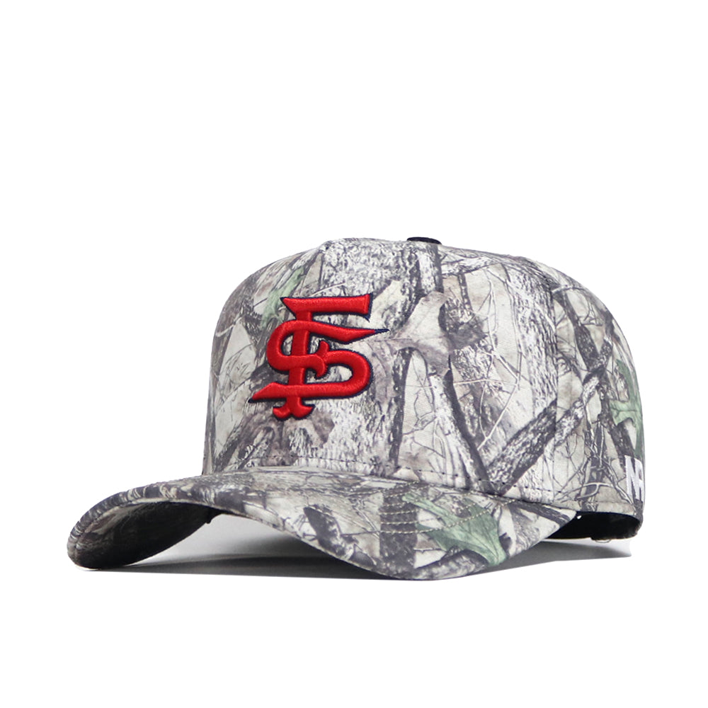 The Fresno State Outland Hat by No Rivals is a structured-fit camouflage cap made from premium cotton, featuring a bold red embroidered STL logo on the front, curved brim, and green, brown, and gray forest-inspired patterns.