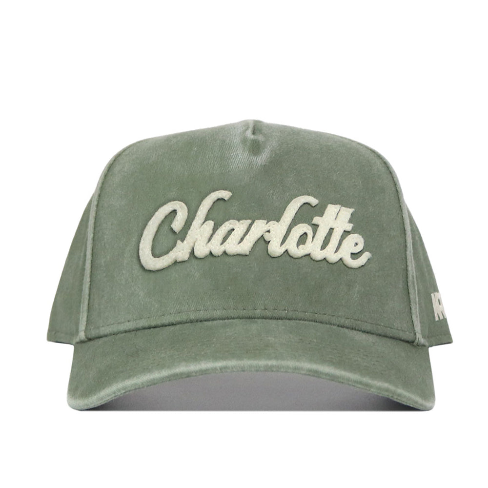Show your Charlotte pride with the No Rivals Charlotte Home Turf Hat—a green snapback featuring “Charlotte” boldly embroidered in large white script across the front, making it the perfect finishing touch for your gameday outfit.
