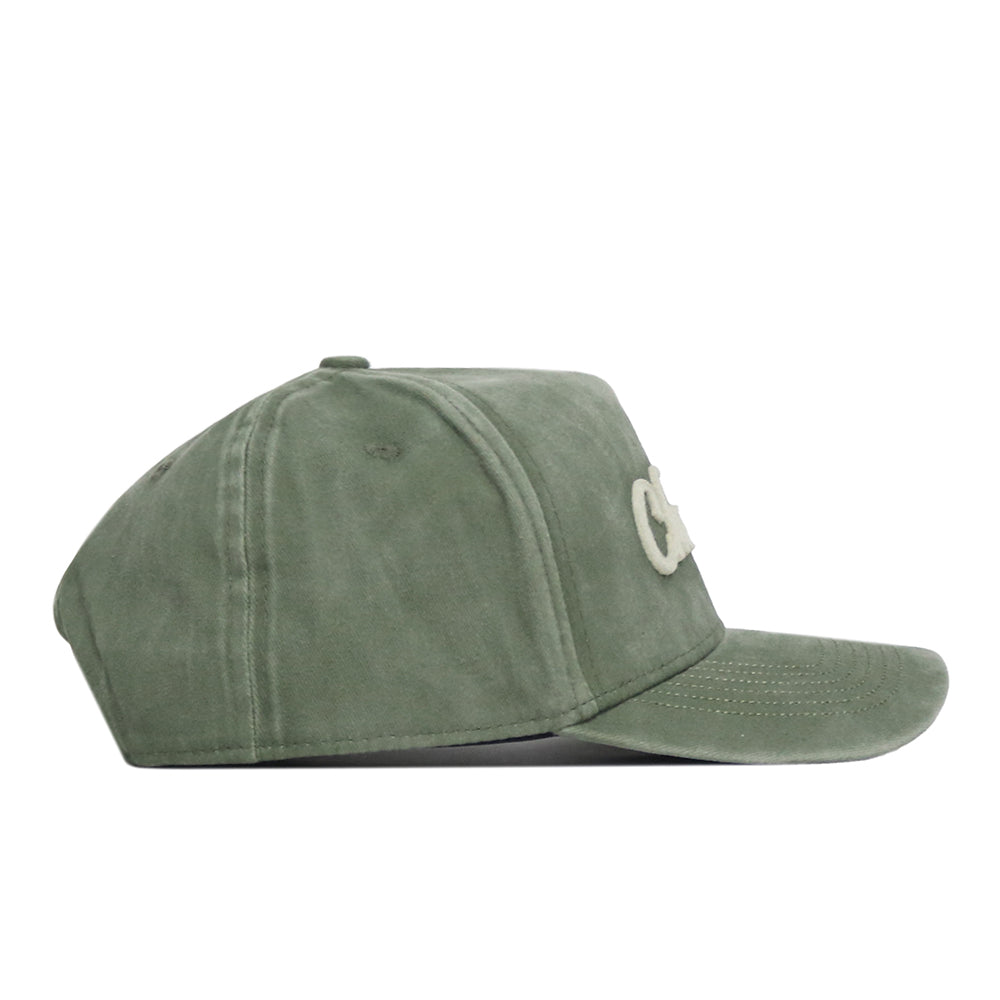 A side view of the No Rivals Charlotte Home Turf Hat in green suede features a snap back, curved brim, and white embroidered logos on the front—perfect for completing your gameday fit.