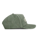 A side view of the No Rivals Charlotte Home Turf Hat in green suede features a snap back, curved brim, and white embroidered logos on the front—perfect for completing your gameday fit.
