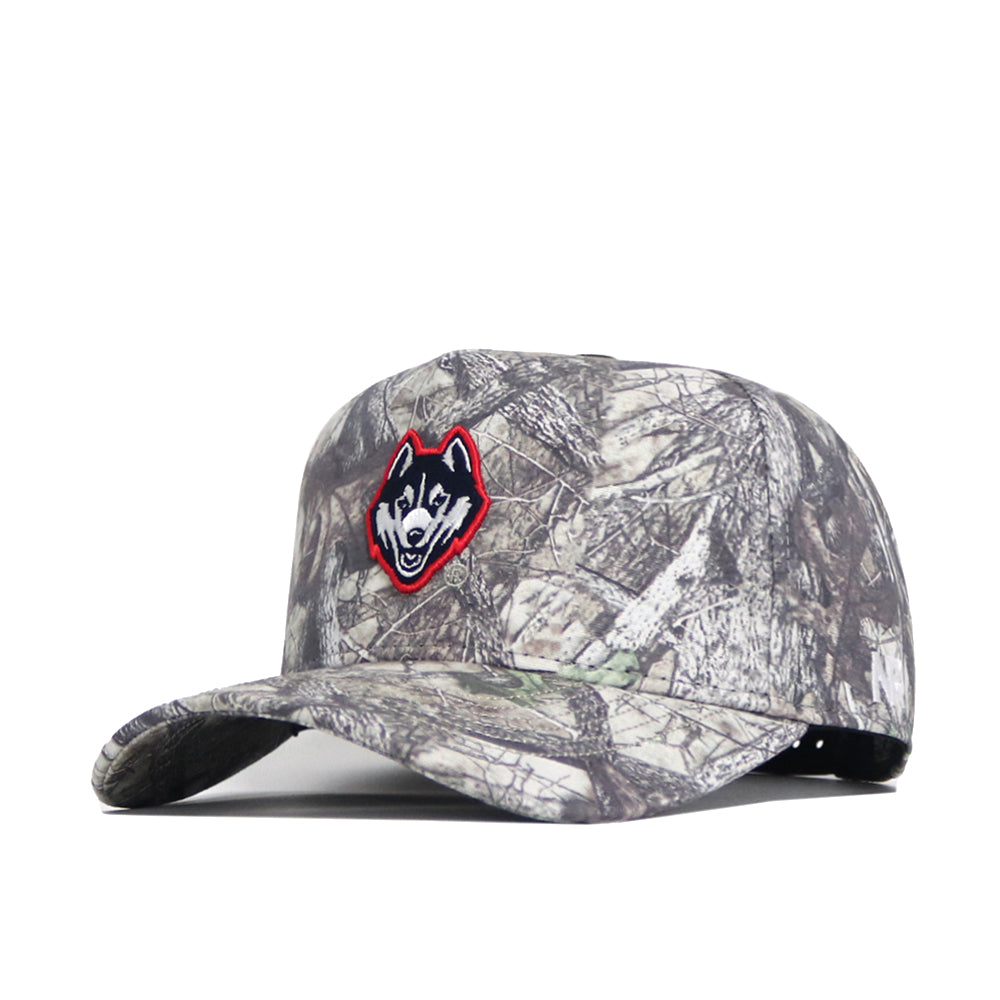The No Rivals UConn Outland Hat is a high-quality cotton camouflage baseball cap with a structured fit and an embroidered husky dog logo on the front, shown angled against a plain white background.