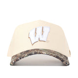 The No Rivals Wisconsin Camo Connector Hat is a beige snapback featuring a prominent white W outlined in brown embroidered on the front, with a camouflage-patterned brim—perfect for completing your gameday fit.