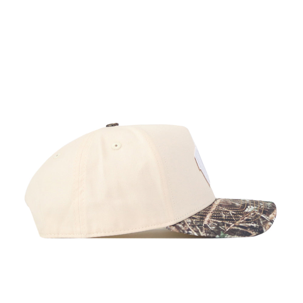 The No Rivals Wisconsin Camo Connector Hat features a beige snapback design with a camouflage-patterned brim, shown in a side profile view against a white background—perfect for finishing your gameday look.