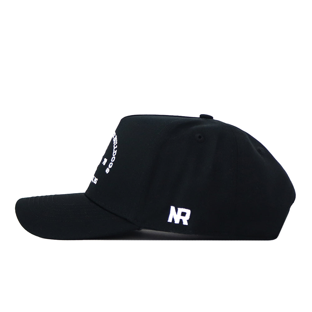 The Mississippi State Outlaw Hat - Black by No Rivals features a black snapback design with a white embroidered NR logo on the side panel. The front showcases partial white text or design, making it the perfect addition to your gameday fit. The hat is displayed against a plain white background.
