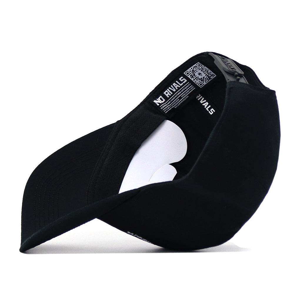 The Mississippi State Outlaw Hat in black by No Rivals is shown upside down, revealing the inside with a white cardboard insert and “NO RIVALS” printed on the inner band. Perfect for your gameday fit, this snapback cap also features an embroidered logo for a stylish finishing touch.
