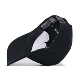 The Georgia Outlaw Hat - Black by No Rivals is displayed upside down, revealing its interior with white cardboard inserts and black inner bands featuring the NO RIVALS branding. A QR code is visible inside the hat, and the Snap Back Adjustment ensures a comfortable and secure Gameday Fit.