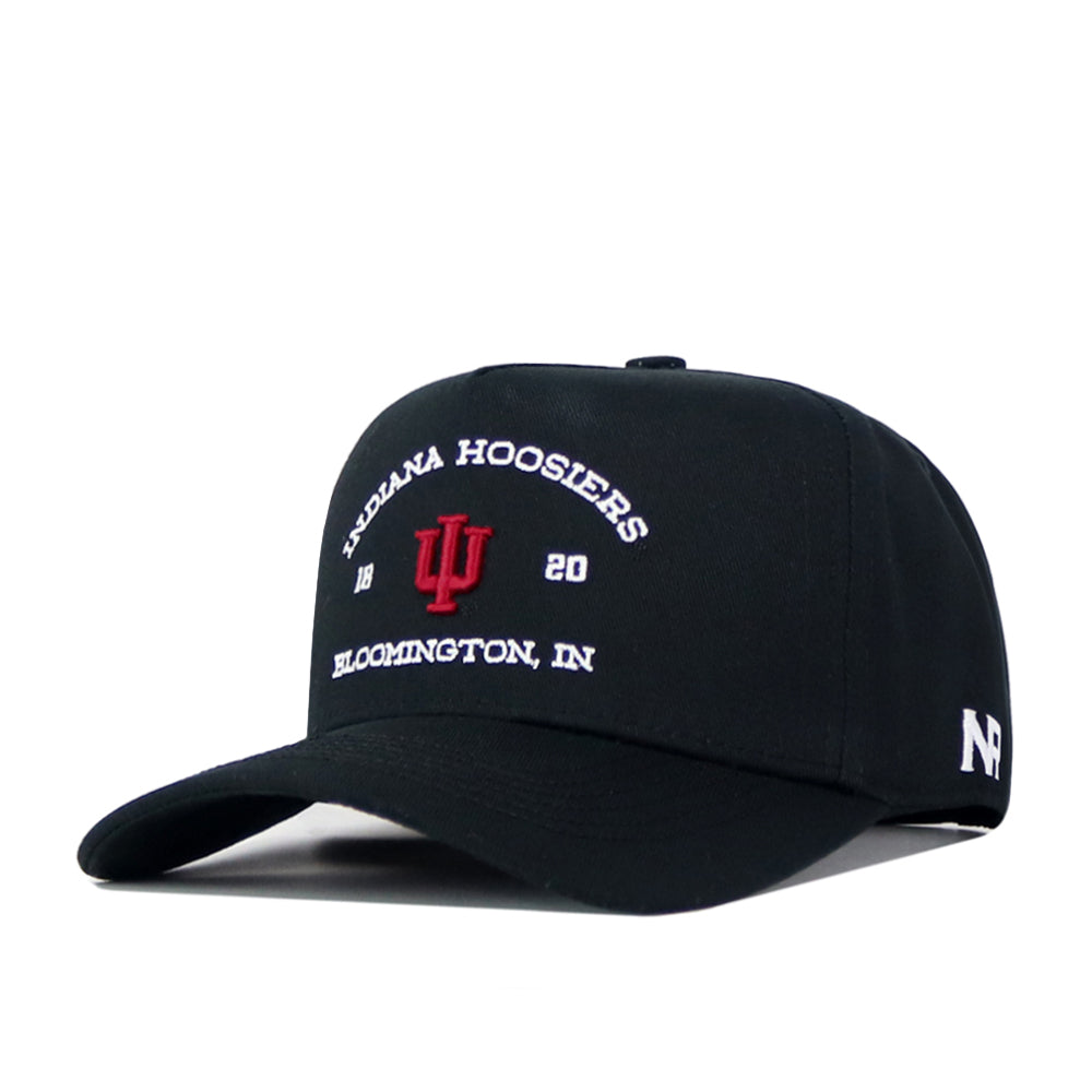 The Indiana Outlaw Hat - Black by No Rivals features “Indiana Hoosiers 1820 Bloomington, IN” and the iconic IU embroidered logo on the front, with a white N logo on the left side and a snap back closure for an adjustable fit. This cap is officially licensed for authentic team style.