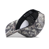 The Maryland Outland Hat by No Rivals is a camouflage snapback shown from an underside angle, highlighting the black inner headband, printed camo pattern, high-quality cotton construction, curved brim, and detailed stitching.