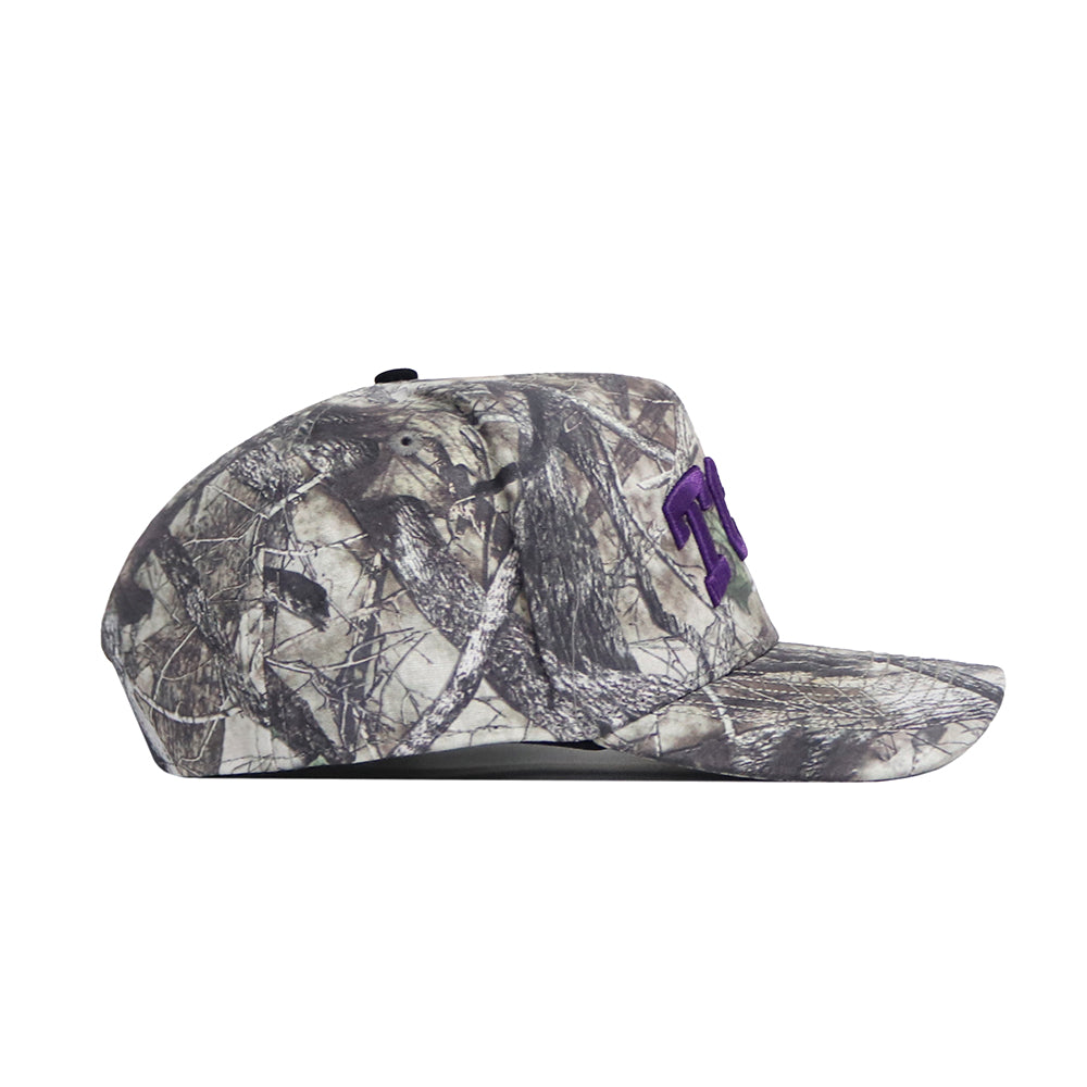 A side view of the No Rivals TCU Outland Hat, a camouflage baseball cap with purple embroidered letters on the front and a structured fit, set against a plain white background.