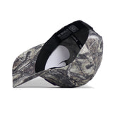 The TCU Outland Hat by No Rivals is shown upside down, revealing its camo interior, black sweatband, and white NO RIVALS label. Bill points left. Offers a structured fit and snapback adjustment for comfort.