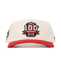The Texas Tech 100th Anniversary Patch Hat is a cream snapback with a red brim, featuring an embroidered 1923 logo on the front and crafted from cotton for a comfortable, structured fit.