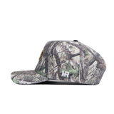 The Colorado Outland Hat by No Rivals is a camouflage flat-brim baseball cap, shown side view, made of high-quality cotton with white "NR" embroidery near the brim and an adjustable snapback for comfort.