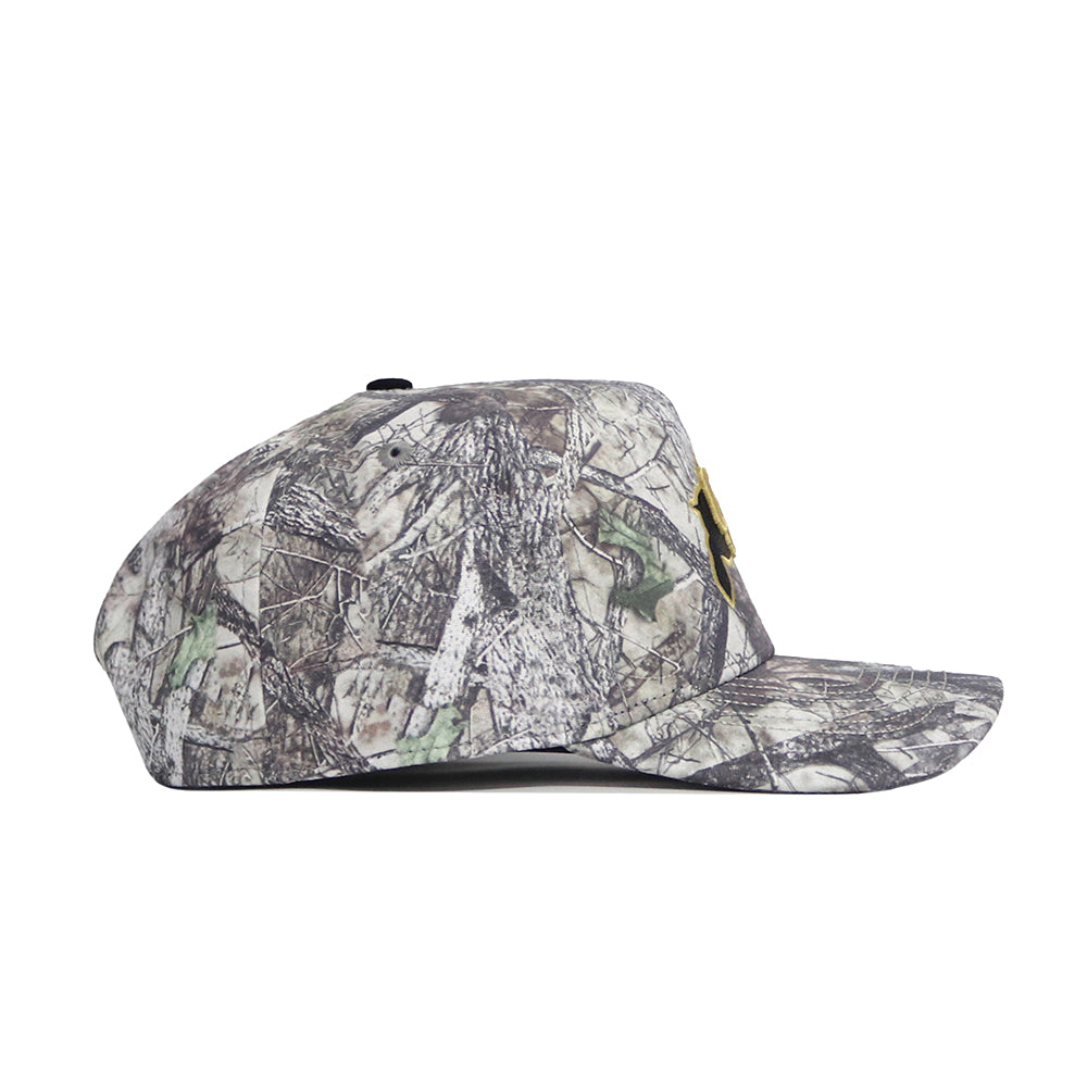 Side view of the No Rivals Colorado Outland Hat, a flat-brim baseball cap with brown, gray, and green camo in earthy, tree-like patterns. Made from high-quality cotton with a structured fit for lasting comfort.