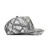 The ETSU Outland Camo Hat by No Rivals displays a side view with a green, brown, and gray camouflage pattern, flat brim, structured fit, and is made from high quality cotton.