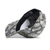 The ETSU Outland Camo Hat by No Rivals is shown on its side, displaying the interior band with the brand name and structured fit, along with its quality cotton construction and camo-patterned snapback design.