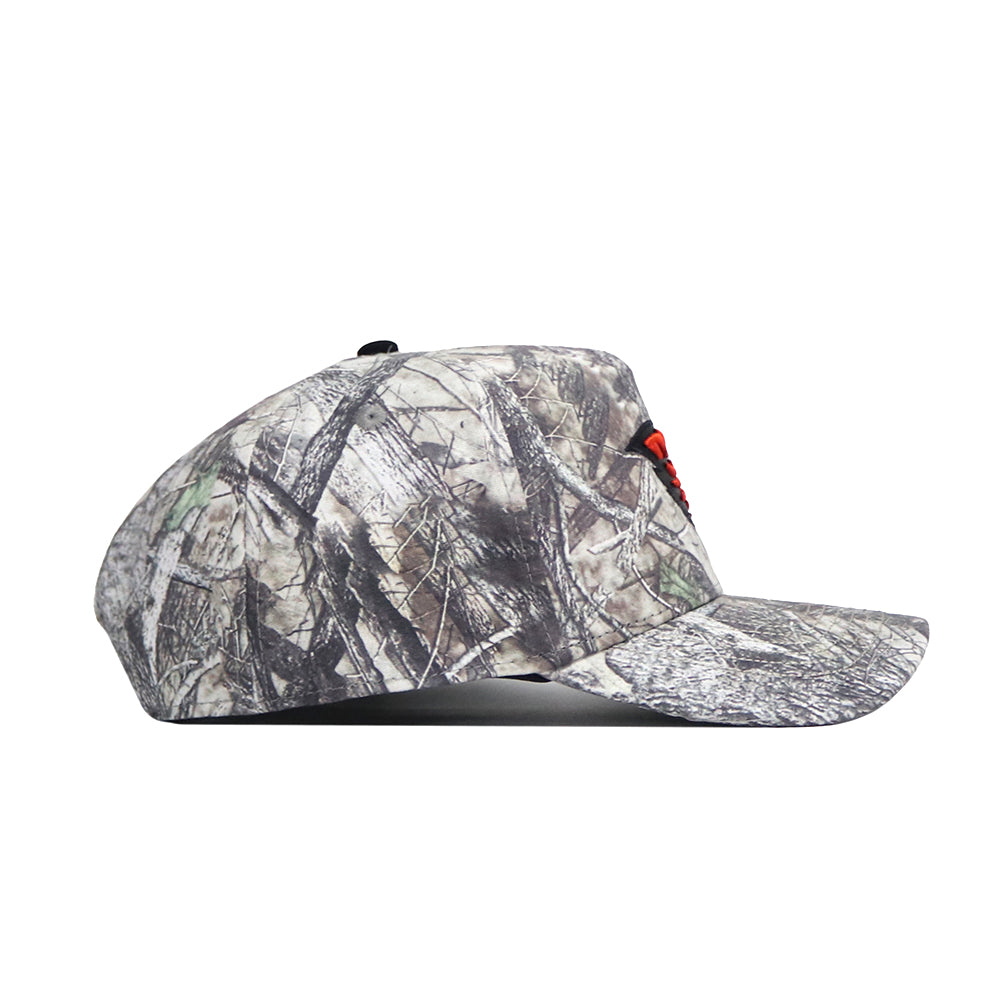 Side view of the No Rivals Oregon State Outland Hat, a snapback with a gray, brown, and green camouflage pattern. Made from high-quality cotton, it features a slightly curved brim and an unstructured crown.