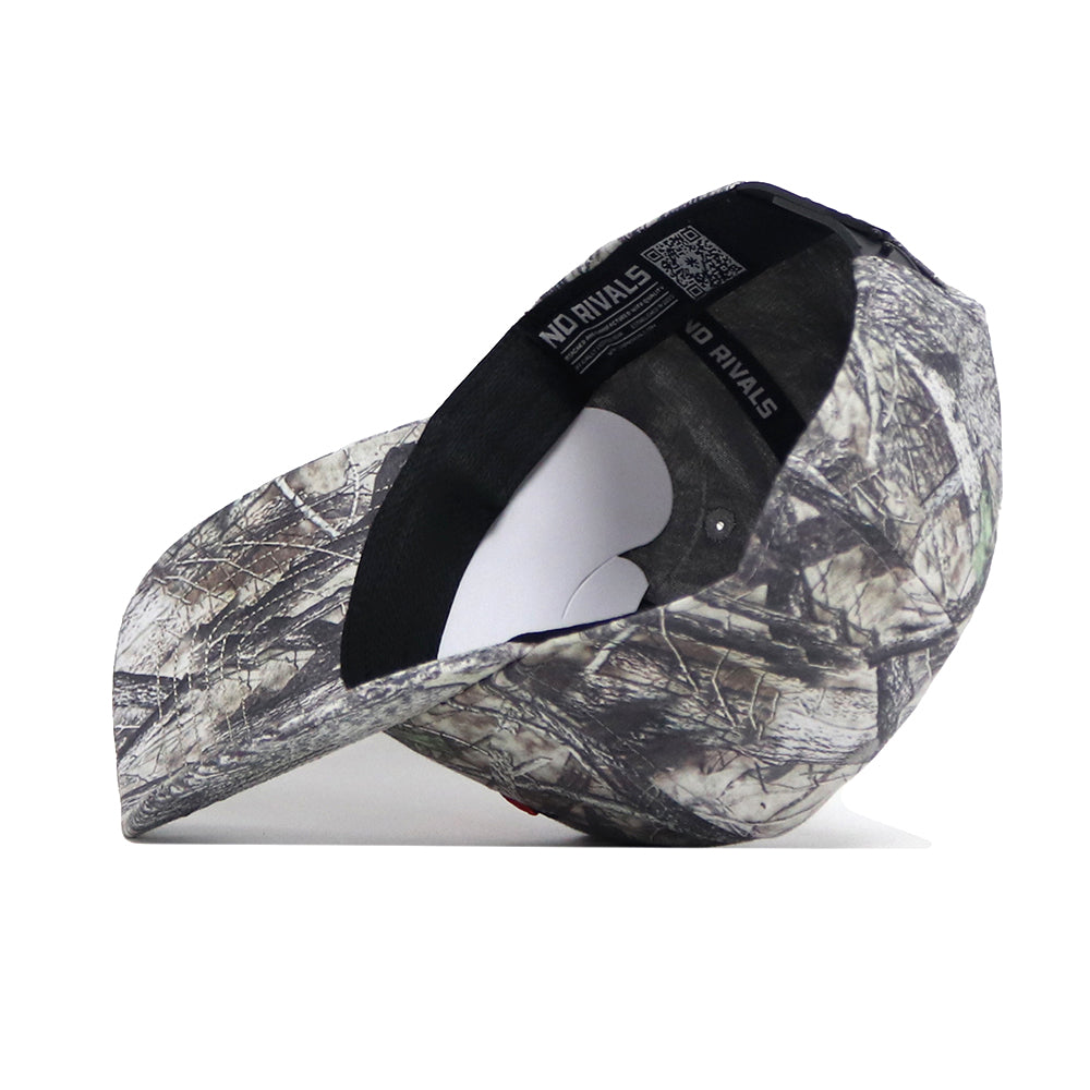 The No Rivals Oregon State Outland Hat, featuring a camouflage pattern, is shown on its side to display the black interior with a white sweatband and printed text along the rim. Crafted from high quality cotton for lasting comfort.