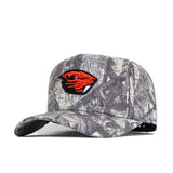The Oregon State Outland Hat by No Rivals is a camouflage snapback featuring an orange and black beaver head logo, a curved brim, adjustable back strap, and high-quality cotton construction.