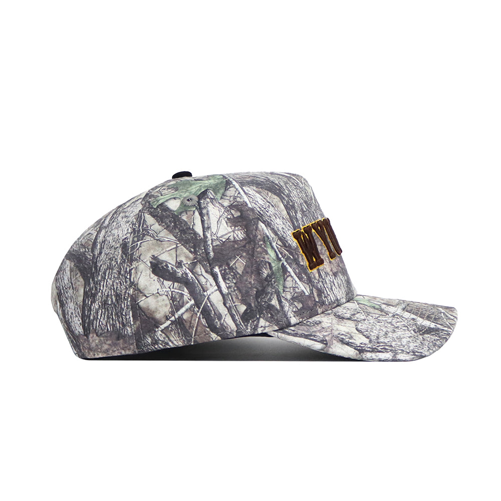 The No Rivals Wyoming Outland Hat is a camouflage snapback made from high-quality cotton, featuring brown embroidered letters on the front and displayed in a side profile view against a white background.