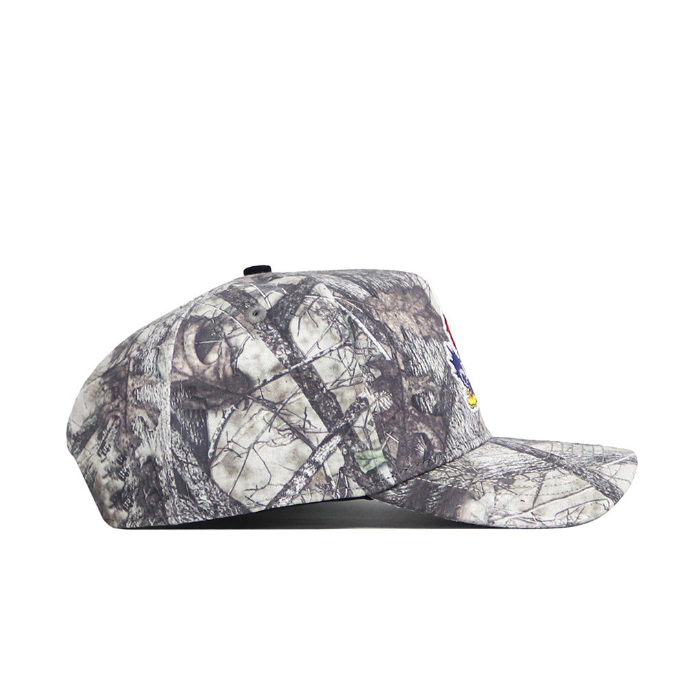 The No Rivals Kansas Outland Hat is a structured fit baseball cap with a gray and brown camo pattern, flat brim, black top button, and classic snapback closure.