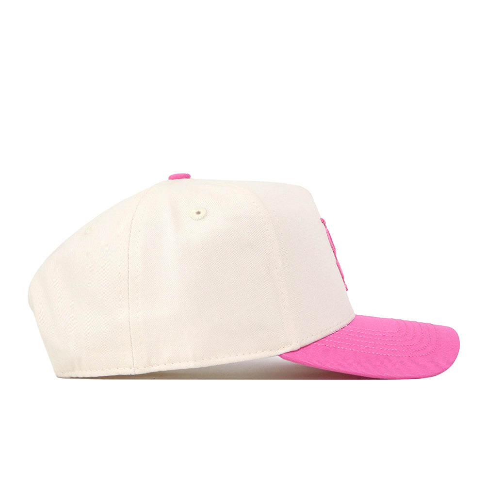 The No Rivals Florida State Pink Out Hat is displayed in a side profile view against a white background, featuring a white base, a vibrant pink curved brim, and a matching pink button on top. It includes a snap back closure for an adjustable, personalized fit.