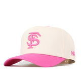 Introducing the Florida State Pink Out Hat by No Rivals—a stylish, officially licensed beige baseball cap featuring a vibrant pink brim and bold, overlapping pink “C” and “S” letters embroidered on the front. The side is adorned with “NR” stitched in matching pink, representing the No Rivals brand. With its convenient snap back adjustment, this eye-catching breast cancer hat seamlessly combines standout design with everyday comfort.