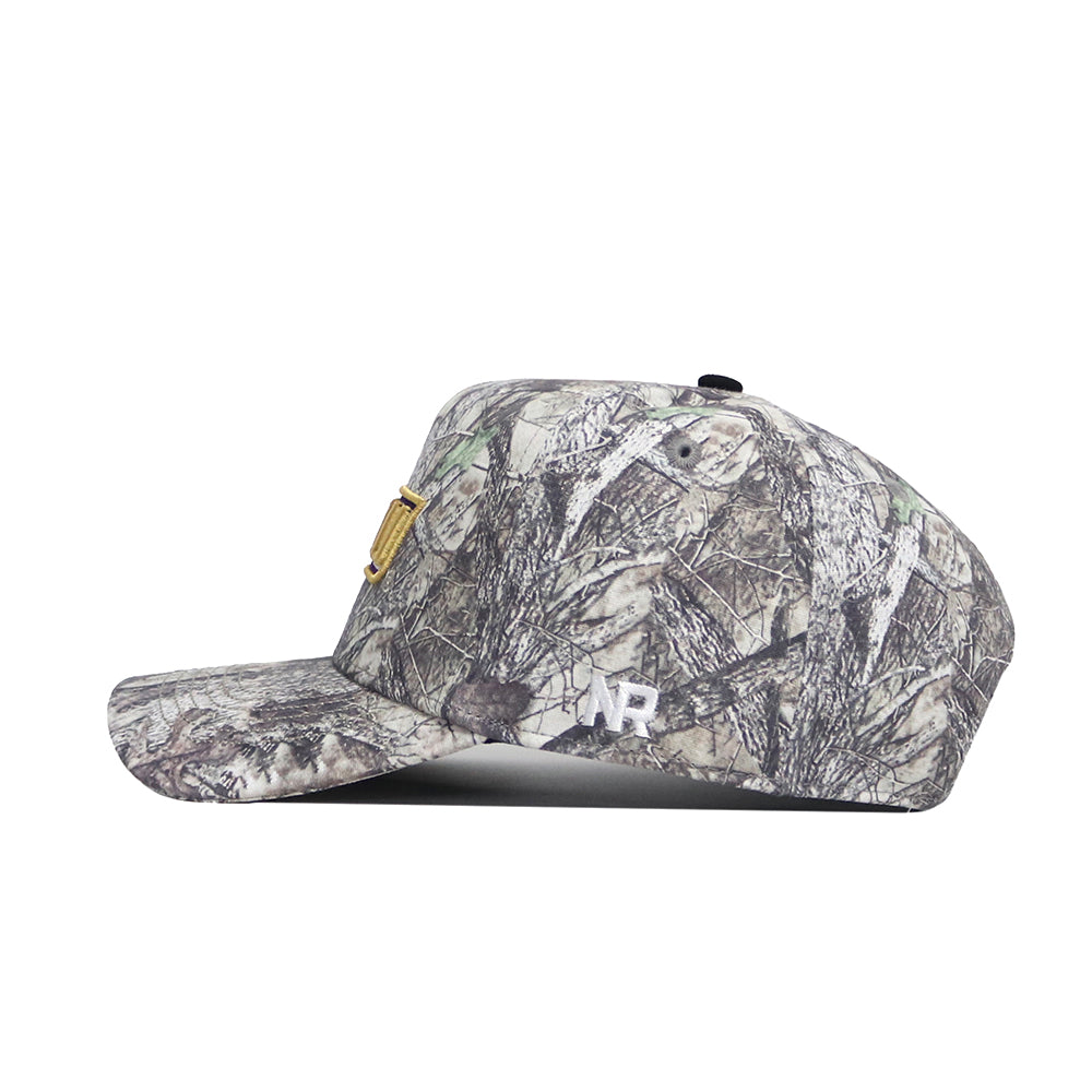 The No Rivals JMU Outland Hat is a high-quality cotton, side-viewed camouflage baseball cap with a flat brim, gold emblem, white AR lettering by the brim, and an adjustable snapback for a perfect fit.