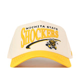 The Wichita State Stride Hat by No Rivals is a cream and yellow baseball cap with an embroidered Shockers logo and mascot, plus a Snap Back Adjustment for the perfect fit.