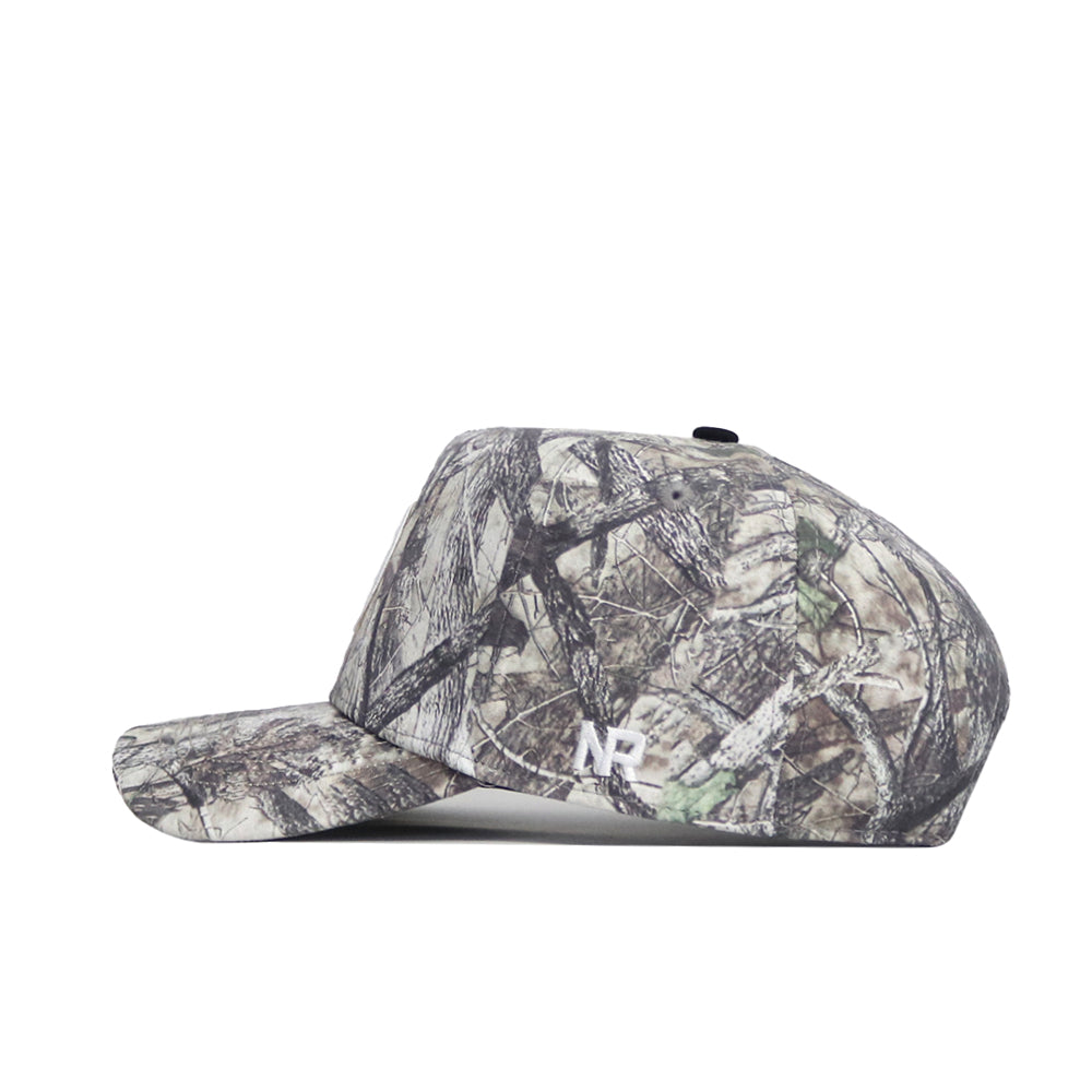 The No Rivals Colorado State Outland Hat is a camo-patterned, flat-brim baseball cap with a structured fit, classic snapback closure, and a white NP logo embroidered near the back, shown from the side.