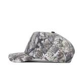The No Rivals Colorado State Outland Hat is a camo-patterned, flat-brim baseball cap with a structured fit, classic snapback closure, and a white NP logo embroidered near the back, shown from the side.