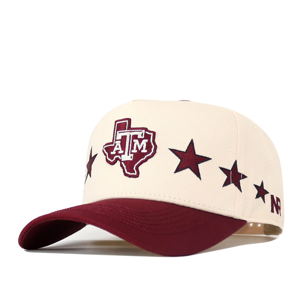 Show your Texas A&M pride with the officially licensed Texas A&M Star Hat by No Rivals. Featuring a cream and maroon snapback design, this hat highlights the embroidered Texas A&M logo inside a Texas outline and maroon stars across the front. The maroon visor adds bold contrast, while “NR” is displayed on the side for added detail. This standout cap blends authentic team spirit with unique style.