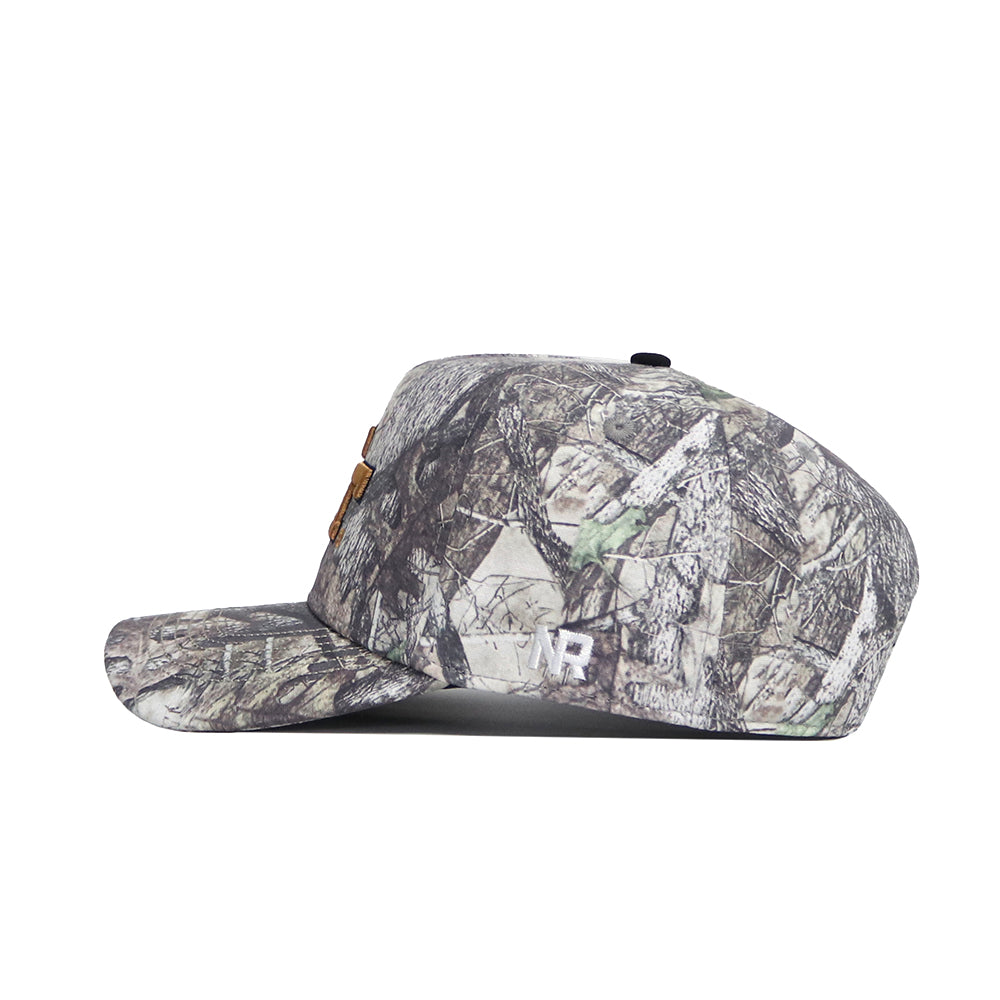 A side view of the Georgia Tech Outland Hat by No Rivals, an officially licensed snapback with a woodland camo pattern, embroidered details, and brown front patches, displayed against a white background.